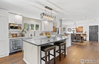 a kitchen with hardwood floors and a center island