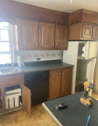 a kitchen with a sink and a refrigerator