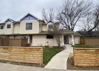 a house with a fence in front of it
