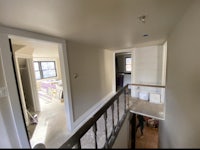 a view of a living room with a staircase