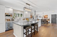 a kitchen with hardwood floors and a center island