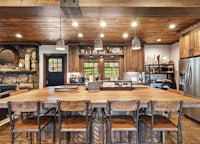 a rustic kitchen with a large center island