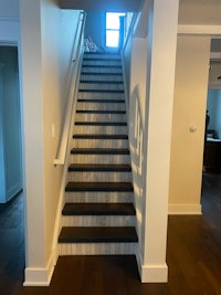 a stairway in a house with hardwood floors