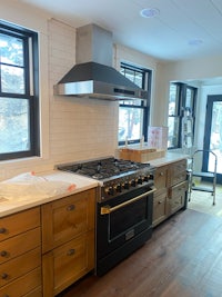a kitchen with a stove and oven