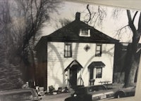 a black and white photo of a house