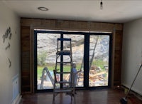 a room being remodeled with a ladder and a ladder